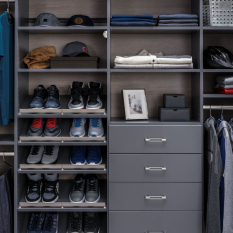 Custom Grey Reach-in Closet with shoe fences, double hang for short hang clothes and medium hang for dress shirts. Lots of upper adjustable shelves.