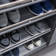 Custom Grey Reach-in Closet with shoe fences, double hang for short hang clothes and medium hang for dress shirts. Lots of upper adjustable shelves.