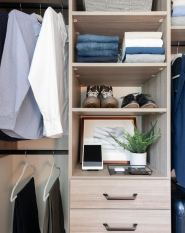 Wood Grain Reach-in Closet Organizer with Black rods and handles for drawers. Simple closet organizer for entry closet or bedroom reach-in.