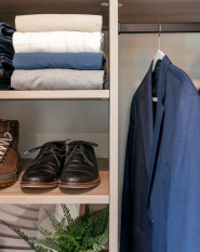 Wood Grain Reach-in Closet Organizer with Black rods and handles for drawers. Simple closet organizer for entry closet or bedroom reach-in.