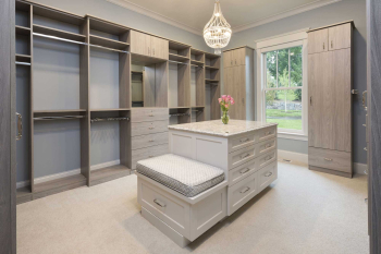 Elegant-Walk-in-Closet-including-Large-Island-with-sitting-bench-and-much-more