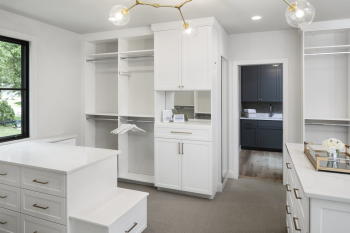 Luxury Boutique Dressing Room Walk-in Closet with Glass Displays. Large Walk-in Closet