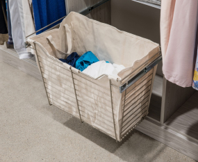 Walk-in Closet Ivory Woodgrain Finish with Shaker Doors. His and her sides of the closet with pull out closet laundry.