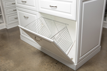 White Raised Panel Walk-in Closet Portland and Lake Oswego. Island with marble top. Glass display case with LED lighting along the sides. Birch dovetail drawers. Pull out jewelry tray organizers and wire laundry baskets.