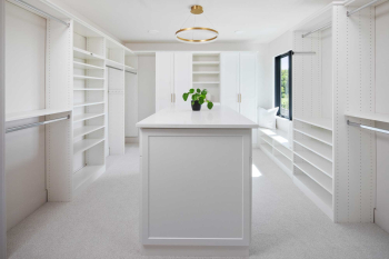 White-Walk-in-with-Large-Island-that-has-Applied-Shaker-End-Panels