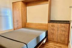 queen size murphy bed with built-in desk wood grain finish
