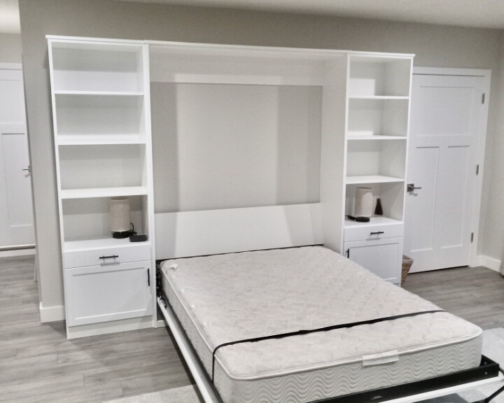 Queen Murphy bed white with TV. Made of out of plycore for lighter weight to hold TV.