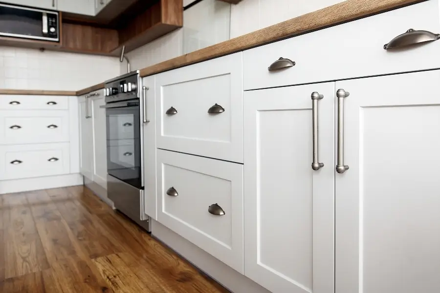 Custom built cabinets close-up, kitchen interior with modern furniture and stainless steel appliances
