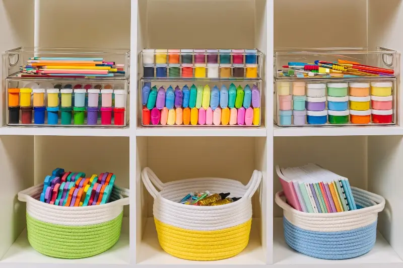 Custom shelving for craft room, storage bins with colorful craft materials