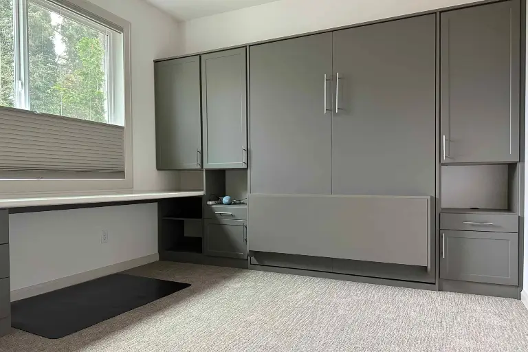Home office with folded away Murphy bed shows how to perfectly fit wall bed within existing space