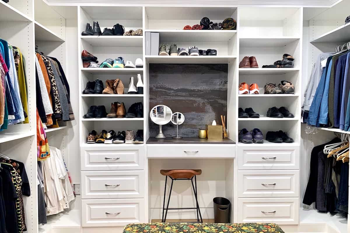 Custom closet by Portland Closet with built-in shelving and hanging rods