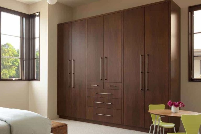 Custom built-in wardrobe closet with hanging rods and shelving