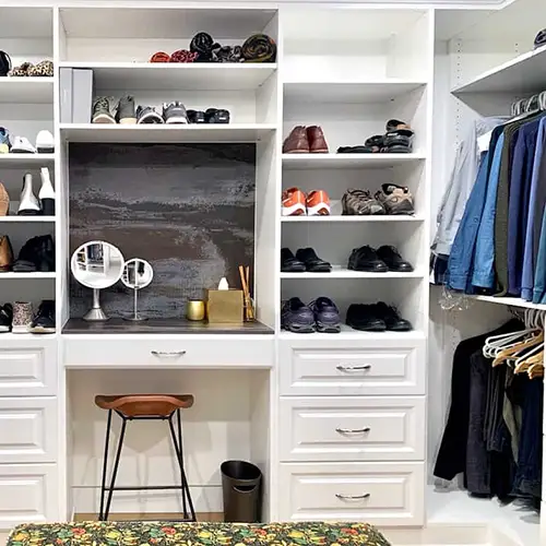 Custom closet by Portland Closet with built-in shelving and hanging rods