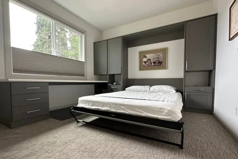 Conserving space in home office as tip for designing your perfect murphy bed. When pulled down, easily converting room into temporary guest room