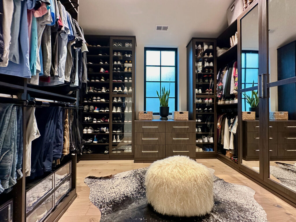 Luxury custom walk-in closet with shelving and hanging space