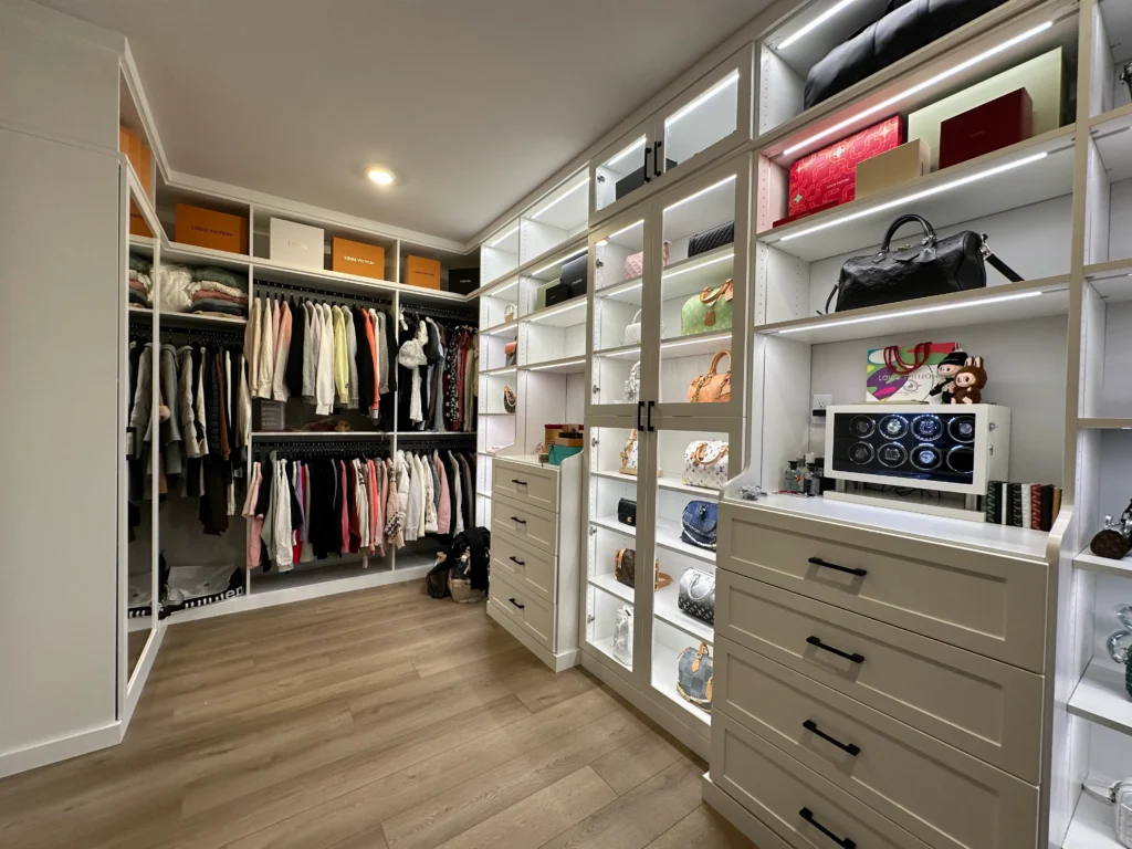 Custom walk-in closet system with shelving and hanging space built by Portland Closet Company in Portland OR