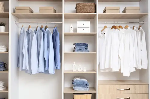 Minimalized closet with shelves and clothes in Portland OR home
