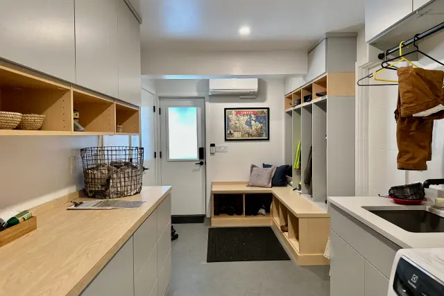 Custom laundry room and mudroom by Portland Closet Company